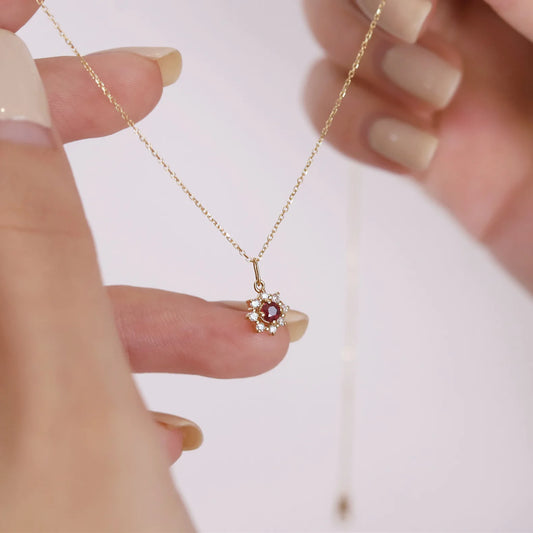 Gleaming 925 sterling silver necklace with a radiant sun pendant featuring a sparkling zircon center and gold-plated accents.