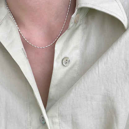 Elegant sterling silver necklace with a geometric zircon pendant sparkling on a delicate 40cm box chain.