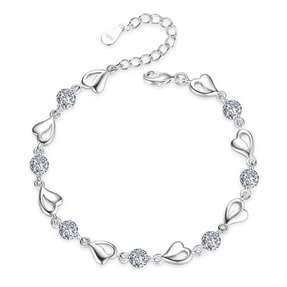 Delicate 925 sterling silver bracelet featuring a heart-shaped design with sparkling zircon crystals for a whimsical touch.