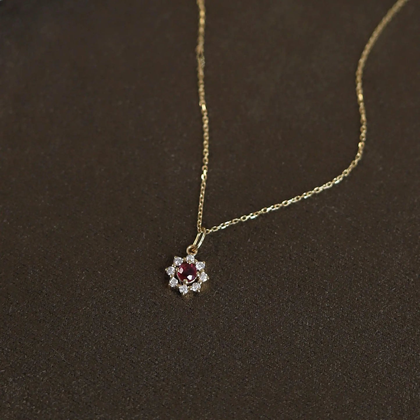 Delicate 925 sterling silver necklace with a radiant sun pendant featuring a sparkling zircon centerpiece and gold-plated accents.