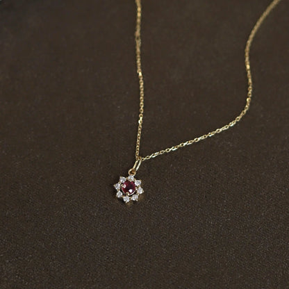 Delicate 925 sterling silver necklace with a radiant sun pendant featuring a sparkling zircon centerpiece and gold-plated accents.