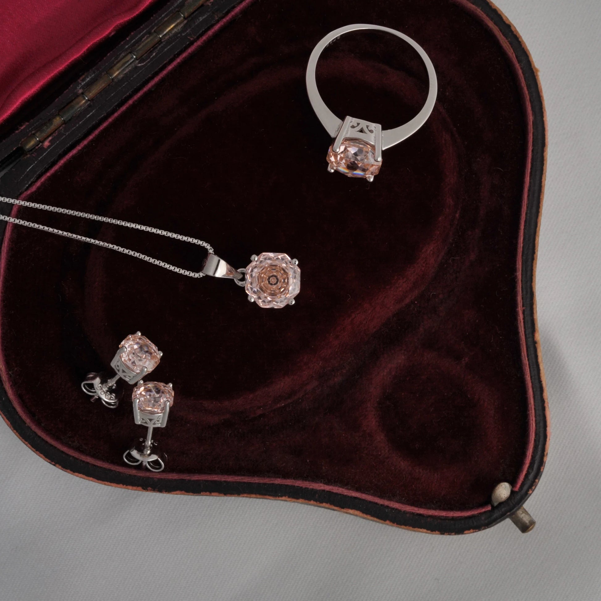 Delicate 2ct morganite pink octagon rose cut pendant necklace with an 8mm zircon, hanging on an 18-inch silver rope chain.