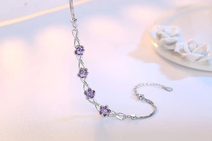 Elegant 925 sterling silver bracelet with a delicate plant motif, sparkling cubic zirconia, and crystal accents.