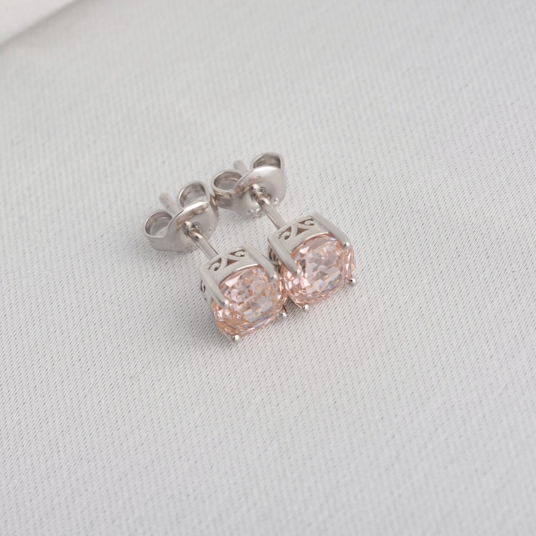 Delicate 1.5ct rose-cut octagon morganite pink stud earrings in white gold-plated sterling silver, sparkling with lab-created zircon accents.