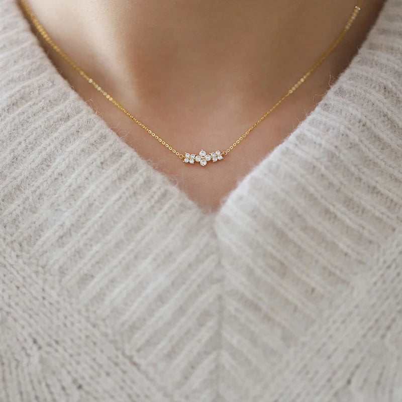 Delicate 925 sterling silver necklace featuring a sparkling moissanite four-leaf clover pendant for luck and elegance.