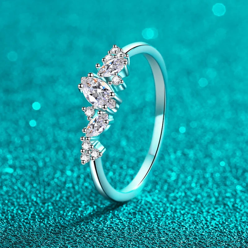 Stunning marquise-cut moissanite solitaire ring in sterling silver, showcasing a sparkling 6x3mm stone in a 4-prong setting.