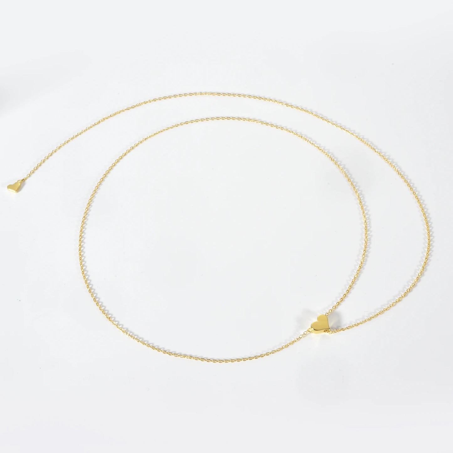Delicate silver heart pendant necklace with a sparkling zircon center on a sleek 65cm snake chain, perfect for office wear.