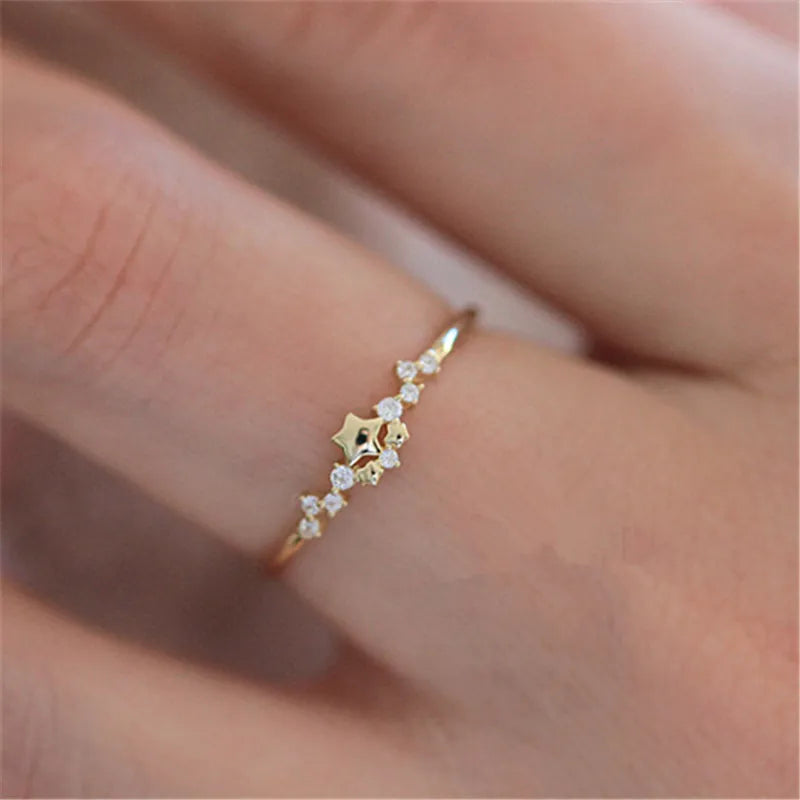Delicate 925 sterling silver ring plated in 14K gold, featuring a sparkling zircon star design for a trendy, elegant look.