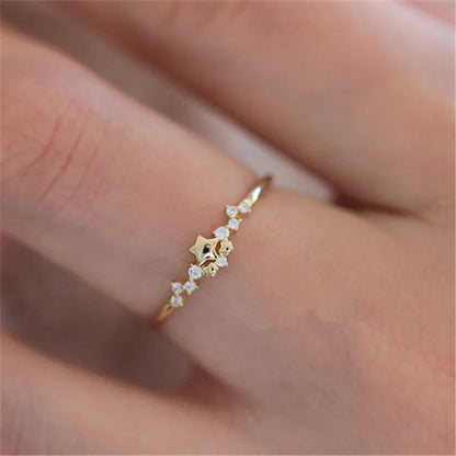 Delicate 925 sterling silver ring plated in 14K gold, featuring a sparkling zircon star design for a trendy, elegant look.