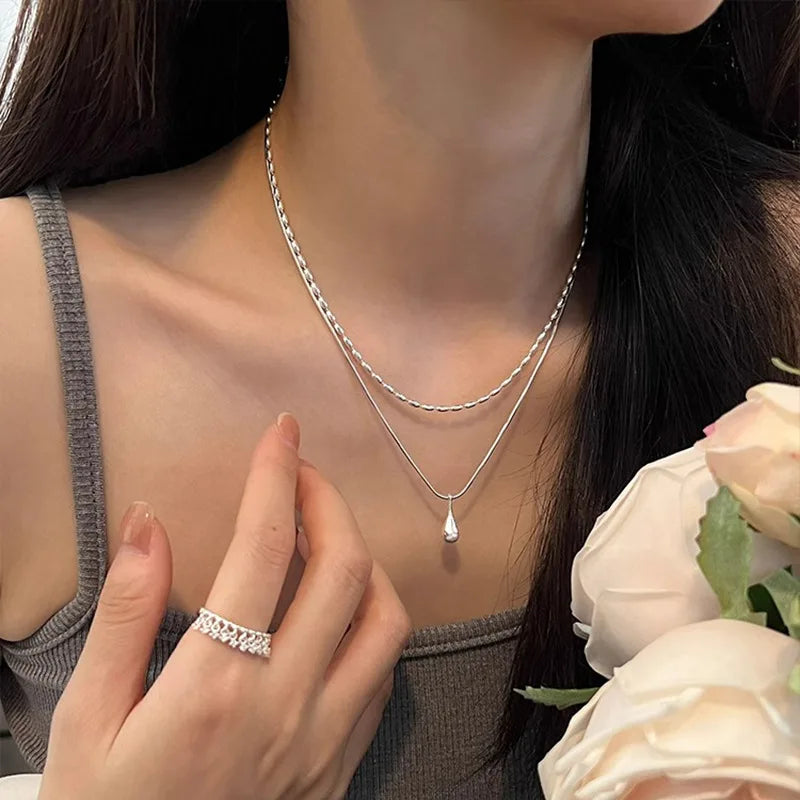 Elegant 925 sterling silver double-layer necklace with a delicate, handmade pendant, perfect for everyday or special events.