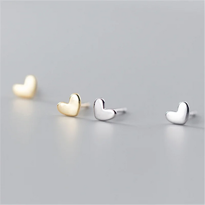 Delicate 925 sterling silver mini heart stud earrings with a chic, minimalist design, perfect for everyday elegance.