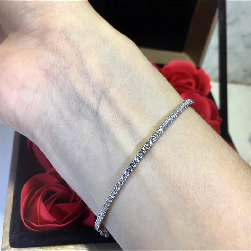 Elegant gold-filled sterling silver bangle with a sparkling prong-set zircon stone, showcasing a minimalist 6cm round design.