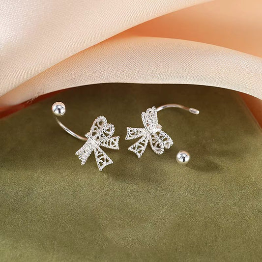 Charming 925 sterling silver bowknot stud earrings with a delicate, romantic design, perfect for any special occasion.