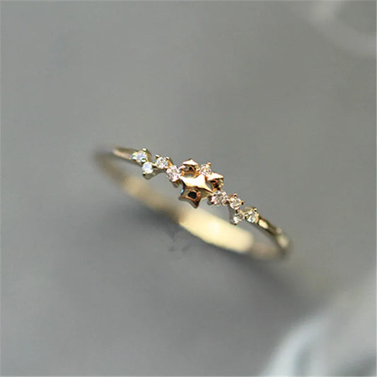 Delicate 925 sterling silver ring plated in 14K gold, featuring a sparkling zircon star design for a trendy, elegant look.